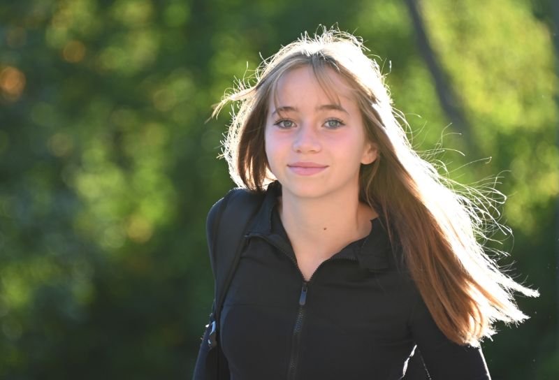 adolescent student walking outdoors