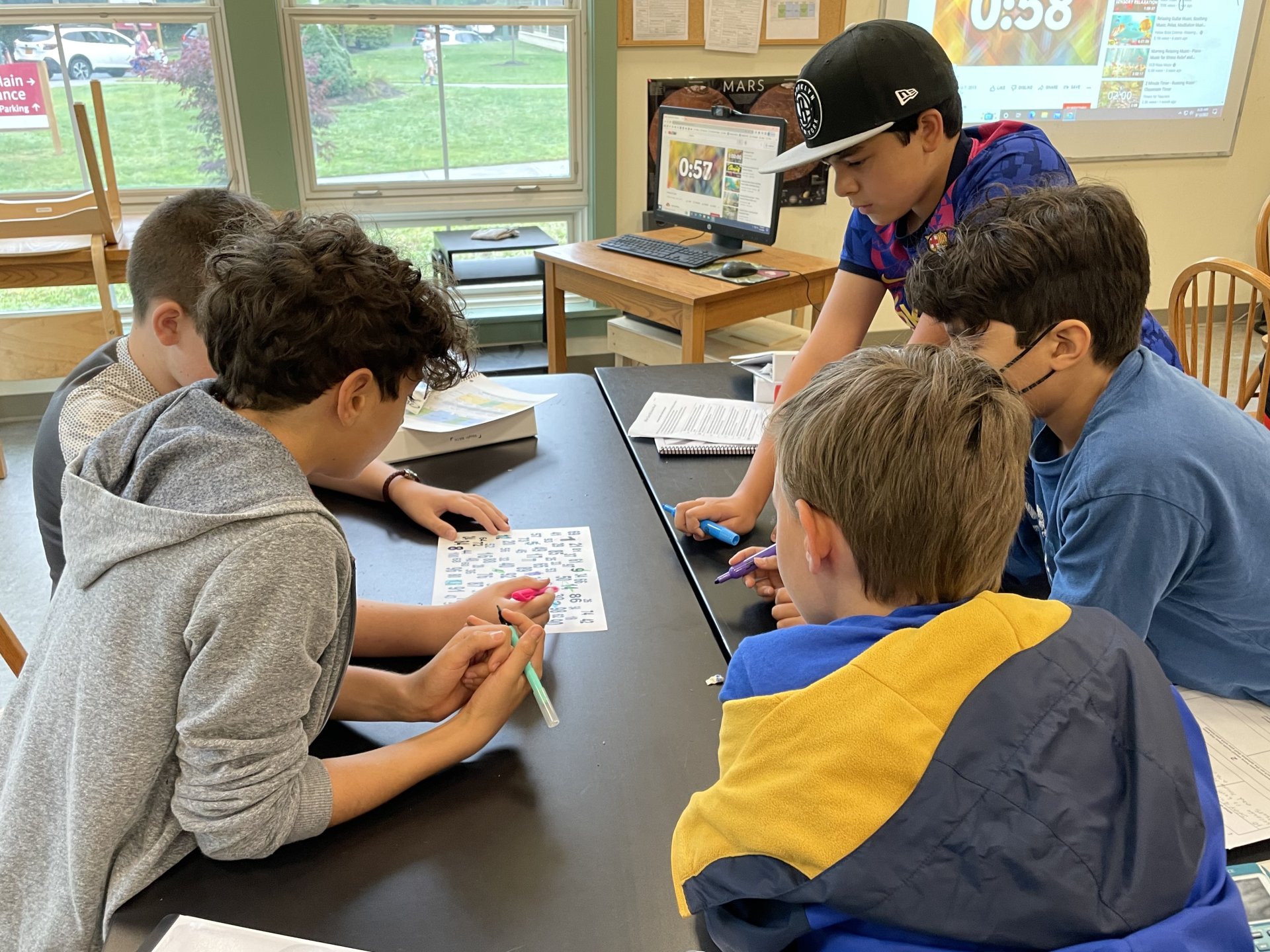 primary student watching colored water experiment
