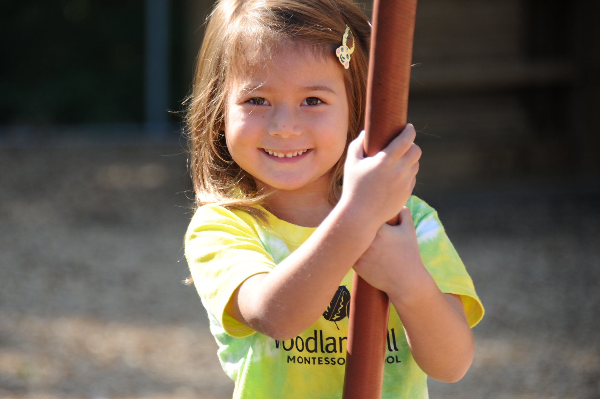 primary student taking a popsicle from a teacher