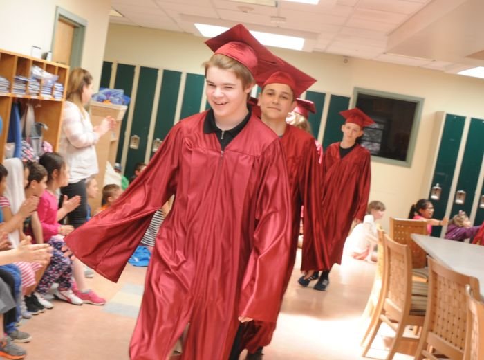 WHMS graduates in cap and gowns